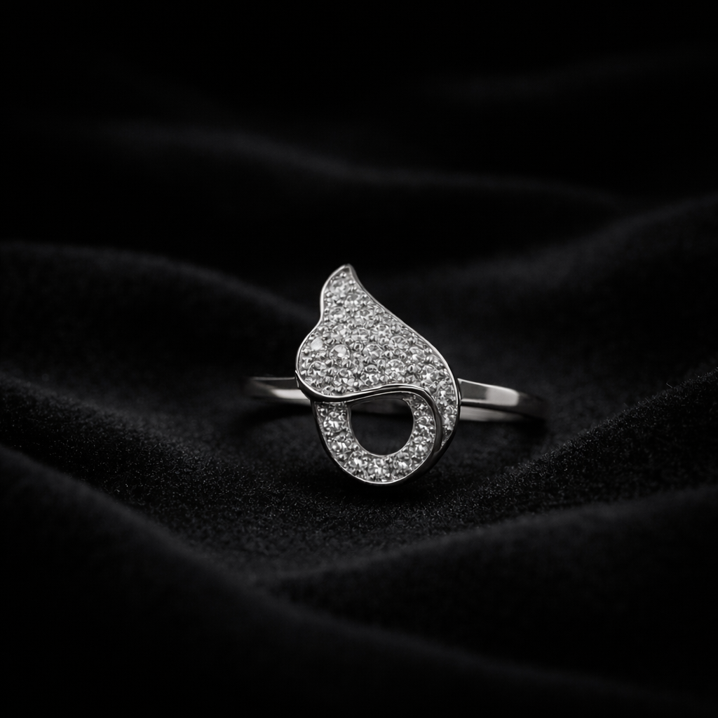 A romantic statement ring defined by a fluid heart-inspired silhouette and a soft cascade of shimmering zircon stones. The Amoria Flow Ring is designed to symbolize effortless love and graceful movement—where curves meet sparkle in perfect harmony. Elegant yet expressive, it adds warmth and charm to every gesture.
