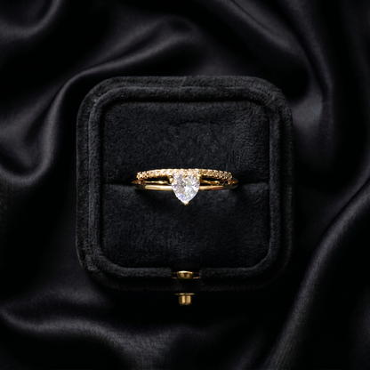 A tiny symbol of love wrapped in crystal sparkle, this ring captures the sweetness of a delicate heart glowing softly with light. Designed with a graceful silhouette and minimal elegance, it brings a romantic charm that feels subtle, timeless, and effortlessly beautiful.