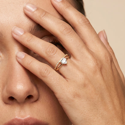A tiny symbol of love wrapped in crystal sparkle, this ring captures the sweetness of a delicate heart glowing softly with light. Designed with a graceful silhouette and minimal elegance, it brings a romantic charm that feels subtle, timeless, and effortlessly beautiful.