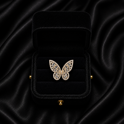 A delicate butterfly frozen in crystal shimmer, this ring captures the beauty of graceful wings touched by light. With its intricate openwork details and sparkling silhouette, it brings a soft yet statement elegance that feels dreamy, feminine, and effortlessly enchanting.