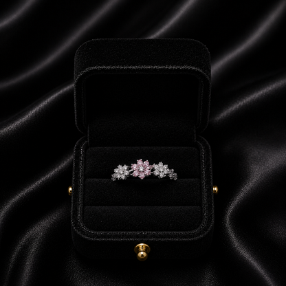 A delicate bloom of shimmering petals, this ring captures the soft elegance of tiny daisies frozen in crystal light. Designed with sparkling floral details and a graceful open silhouette, it brings a dreamy charm that feels both feminine and timeless.