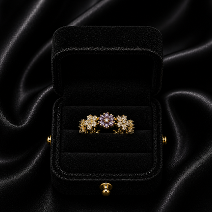 A delicate bloom of shimmering petals, this ring captures the soft elegance of tiny daisies frozen in crystal light. Designed with sparkling floral details and a graceful open silhouette, it brings a dreamy charm that feels both feminine and timeless.