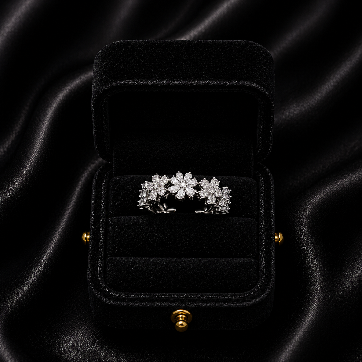 A delicate bloom of shimmering petals, this ring captures the soft elegance of tiny daisies frozen in crystal light. Designed with sparkling floral details and a graceful open silhouette, it brings a dreamy charm that feels both feminine and timeless.
