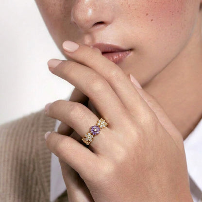 A delicate bloom of shimmering petals, this ring captures the soft elegance of tiny daisies frozen in crystal light. Designed with sparkling floral details and a graceful open silhouette, it brings a dreamy charm that feels both feminine and timeless.