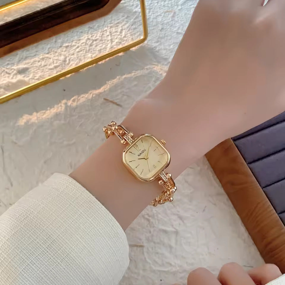 The Elite Eternity Watch redefines elegance with its sophisticated square small dial and a light luxury Cuban-inspired strap. This timepiece seamlessly blends the bold aesthetic of a high-end bracelet with the precision of a modern quartz movement, making it a standout accessory for any trendsetting wardrobe.