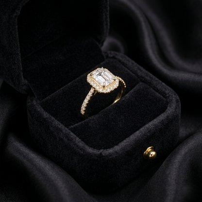 A radiant sparkle framed in timeless elegance, this ring captures the refined beauty of emerald-inspired brilliance with a soft shimmering glow. Featuring a delicate rectangular crystal centerpiece surrounded by sparkling accents, it brings a graceful charm that feels luxurious, modern, and effortlessly sophisticated.