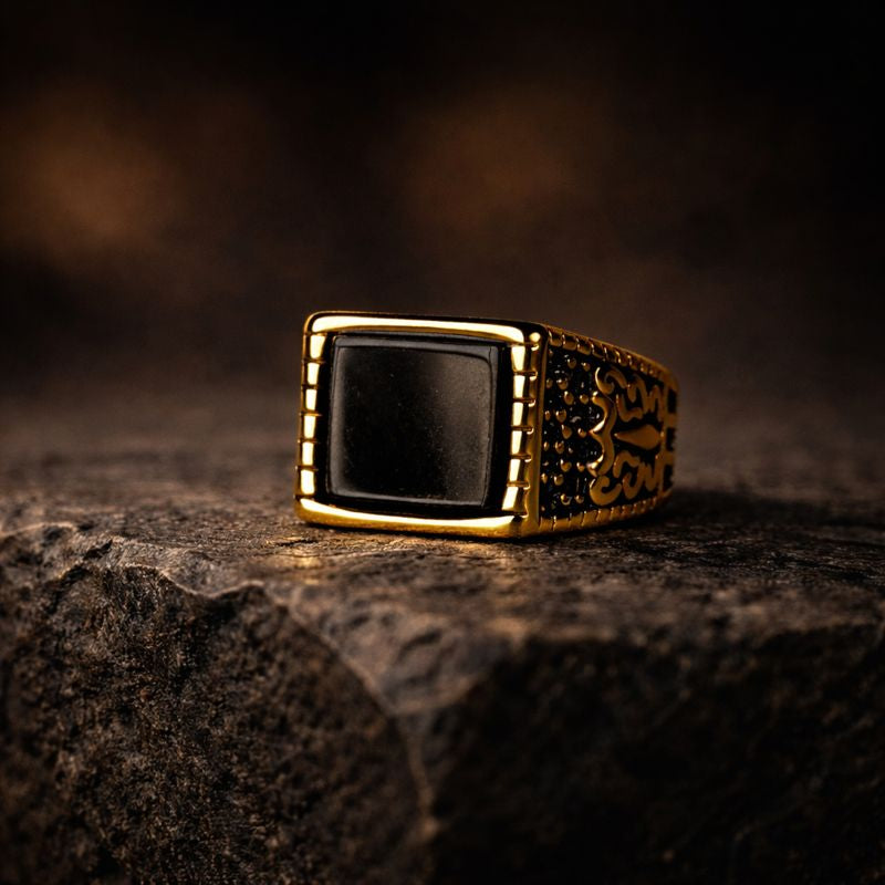 Minimal yet commanding, the Envy Prime Ring is designed around precision and power. Its sharp rectangular black stone sits confidently in a rich gold-tone body, creating a striking contrast that speaks of dominance, refinement, and quiet authority. This is luxury at its peak, nothing excess, nothing ordinary.