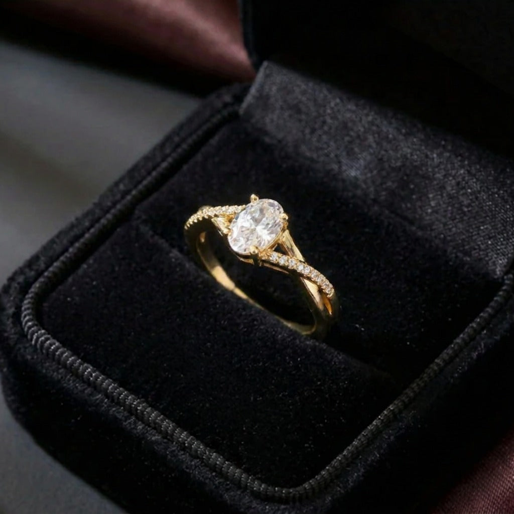 A soft radiance wrapped in timeless elegance, this ring captures the beauty of everlasting sparkle with its luminous oval centerpiece and gracefully flowing band. The delicate crystal accents create a refined silhouette that feels romantic, elegant, and effortlessly luxurious.