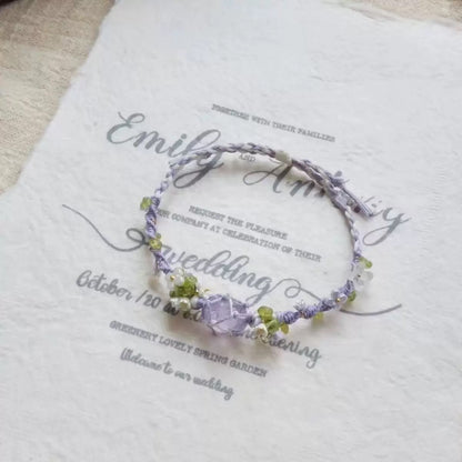 A delicate fusion of art and nature, the Handmade Lavender Iris Bracelet captures the ethereal charm of a Monet-inspired garden. Its intricate Mori-style weaving and vibrant crystal accents offer a healing aesthetic that is both whimsical and serene.