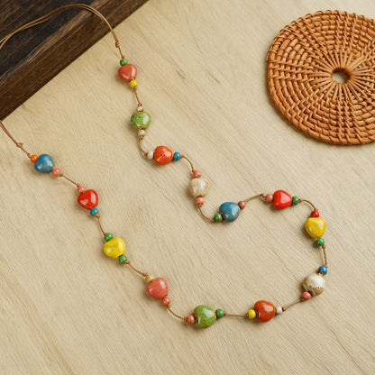 A vibrant expression of joy and love, this handcrafted piece blends colorful ceramic beads with playful heart accents to create a look that feels both artistic and full of life. Each bead carries a unique charm, making it a statement of warmth, personality, and effortless style.