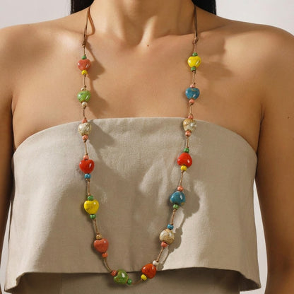 A vibrant expression of joy and love, this handcrafted piece blends colorful ceramic beads with playful heart accents to create a look that feels both artistic and full of life. Each bead carries a unique charm, making it a statement of warmth, personality, and effortless style.