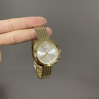 Designed for effortless everyday style, the Lume Classic Watch features a refined sunray dial with slim pointer markers, framed in a polished square case and finished with a stainless-steel mesh strap that drapes beautifully on the wrist. Minimal, feminine, and timeless.