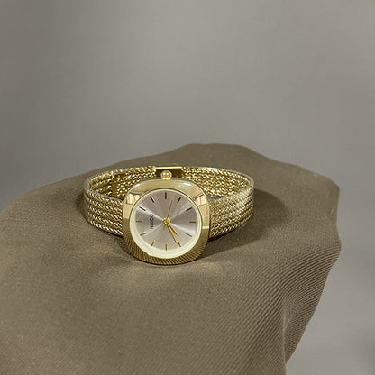 Designed for effortless everyday style, the Lume Classic Watch features a refined sunray dial with slim pointer markers, framed in a polished square case and finished with a stainless-steel mesh strap that drapes beautifully on the wrist. Minimal, feminine, and timeless.