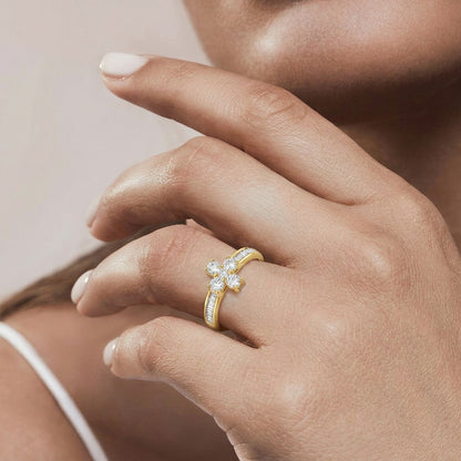 A graceful floral silhouette crowned with radiant sparkle, this ring blends delicate bloom details with refined brilliance. The crystal flower centerpiece paired with elegant baguette accents creates a timeless design that feels romantic, luxurious, and effortlessly charming.