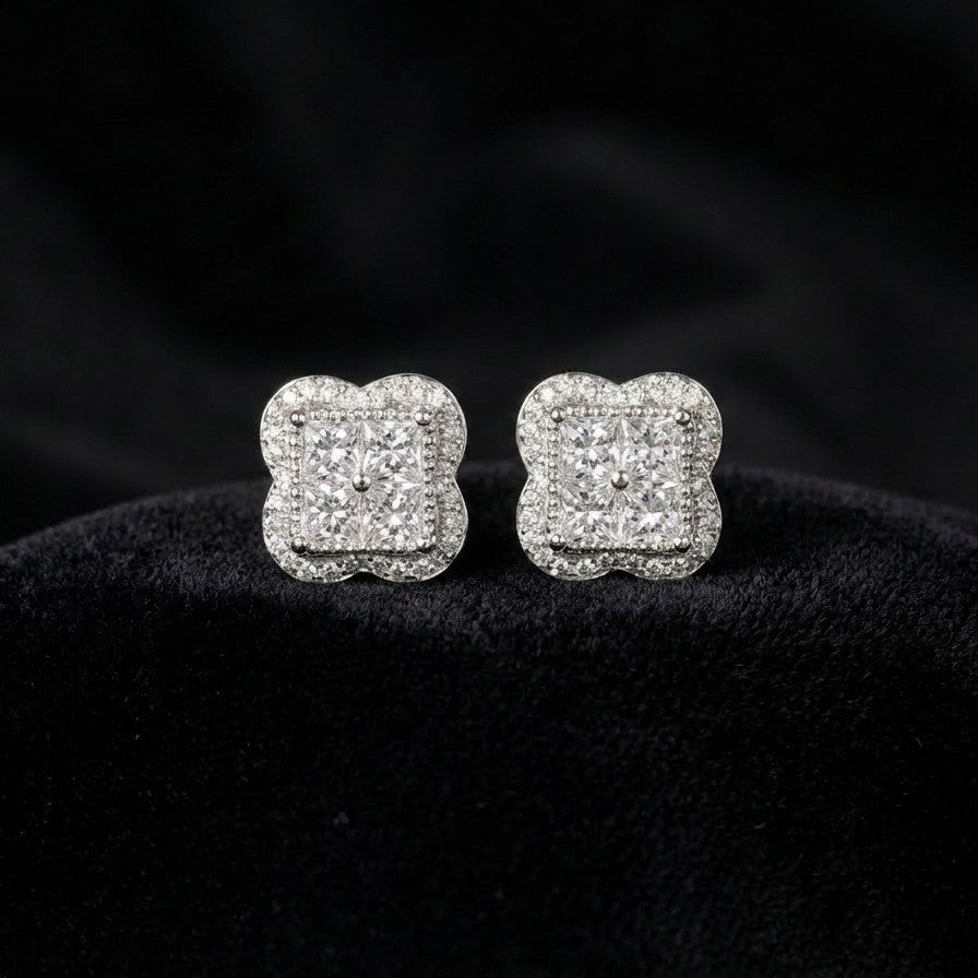 A quiet sparkle with a bold presence, the Nova Studs capture the brilliance of a star in a refined, minimalist design. Featuring a radiant square crystal centerpiece framed by delicate shimmering accents, these studs reflect light beautifully from every angle. Elegant yet versatile, they bring a graceful glow to both everyday looks and special moments.
