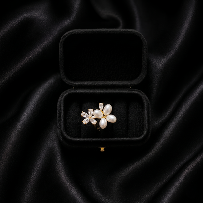 Let your style take flight with a piece that captures the delicate beauty of a garden in spring. The Pearl Papillon Ring features a breathtaking butterfly-inspired floral design, blending the soft luster of pearls with a high-fashion golden glow. It’s a whimsical yet sophisticated statement piece that adds a touch of ethereal charm to any outfit.