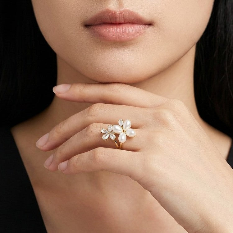 Let your style take flight with a piece that captures the delicate beauty of a garden in spring. The Pearl Papillon Ring features a breathtaking butterfly-inspired floral design, blending the soft luster of pearls with a high-fashion golden glow. It’s a whimsical yet sophisticated statement piece that adds a touch of ethereal charm to any outfit.