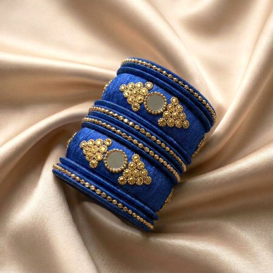 Crafted with rich silk thread and adorned with intricate golden embellishments, the Reshmi Bangles bring a bold festive charm to your look. Each stack carries a unique handcrafted touch — making every piece slightly different, yet equally stunning.
