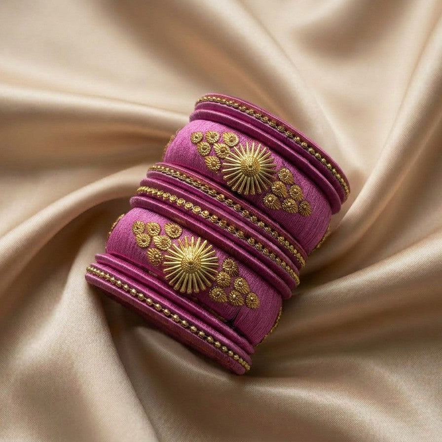 Crafted with rich silk thread and adorned with intricate golden embellishments, the Reshmi Bangles bring a bold festive charm to your look. Each stack carries a unique handcrafted touch making every piece slightly different, yet equally stunning.