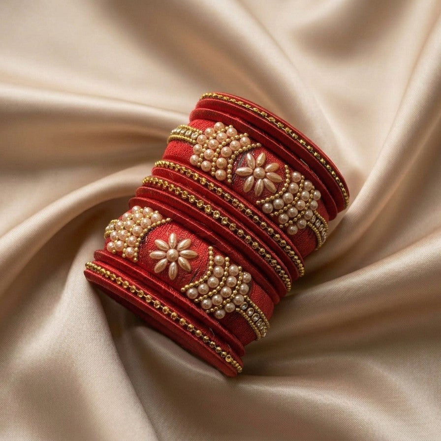 Crafted with rich silk thread and adorned with intricate golden embellishments, the Reshmi Bangles bring a bold festive charm to your look. Each stack carries a unique handcrafted touch making every piece slightly different, yet equally stunning.