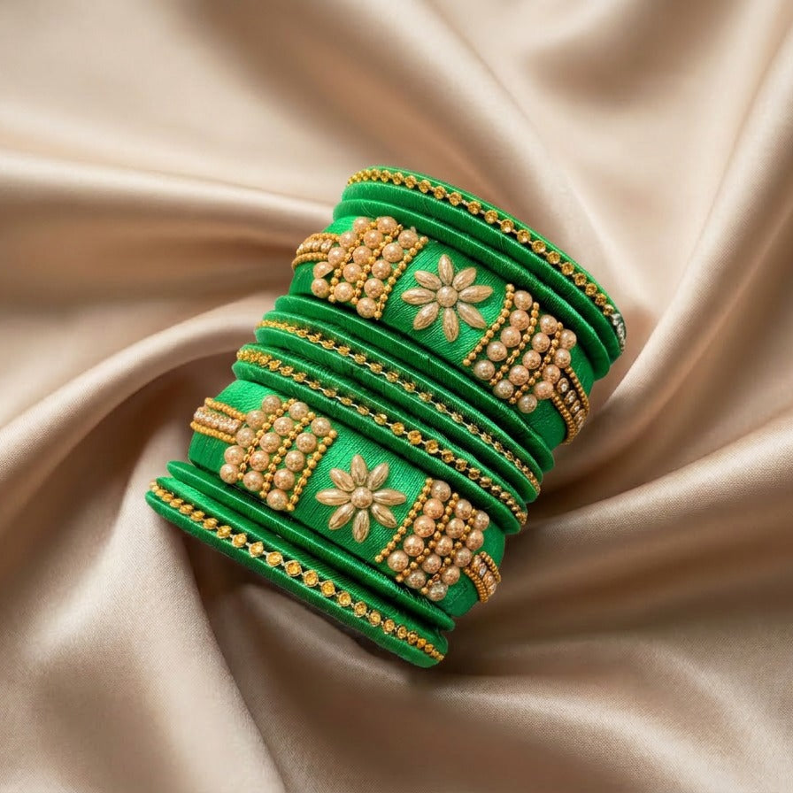 Crafted with rich silk thread and adorned with intricate golden embellishments, the Reshmi Bangles bring a bold festive charm to your look. Each stack carries a unique handcrafted touch — making every piece slightly different, yet equally stunning.