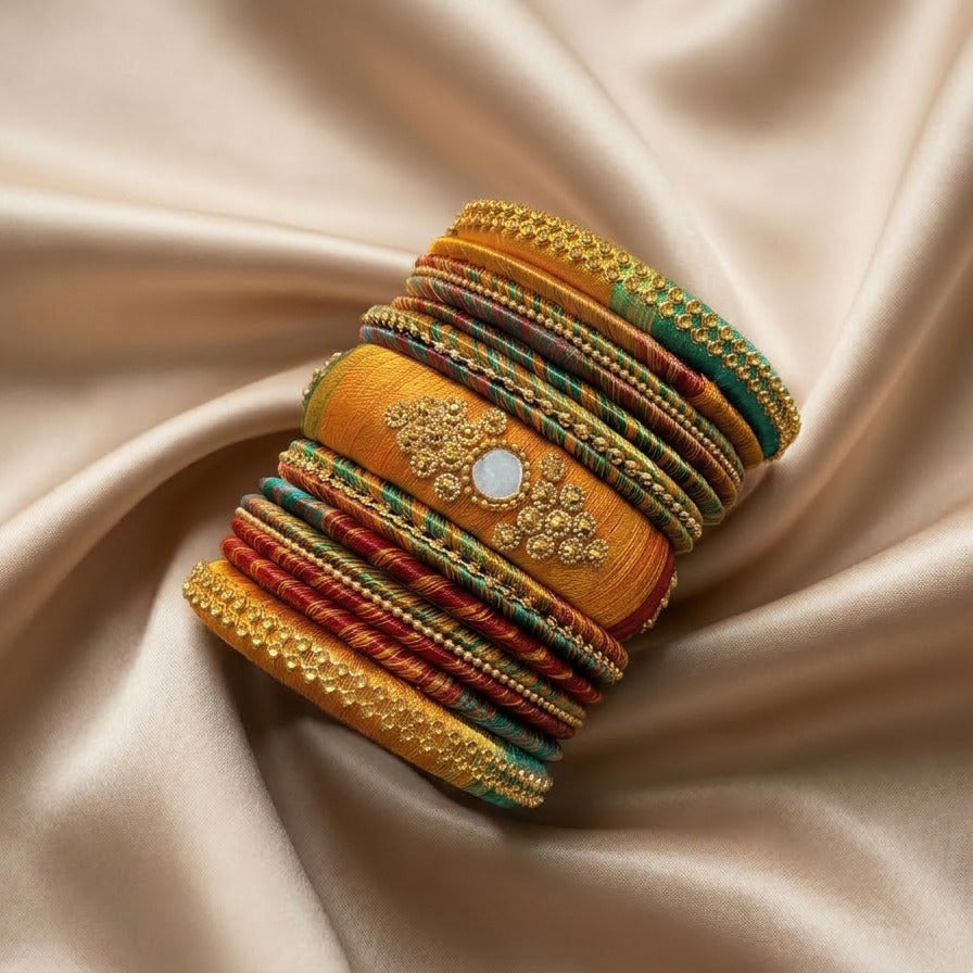 Crafted with rich silk thread and adorned with intricate golden embellishments, the Reshmi Bangles bring a bold festive charm to your look. Each stack carries a unique handcrafted touch — making every piece slightly different, yet equally stunning.