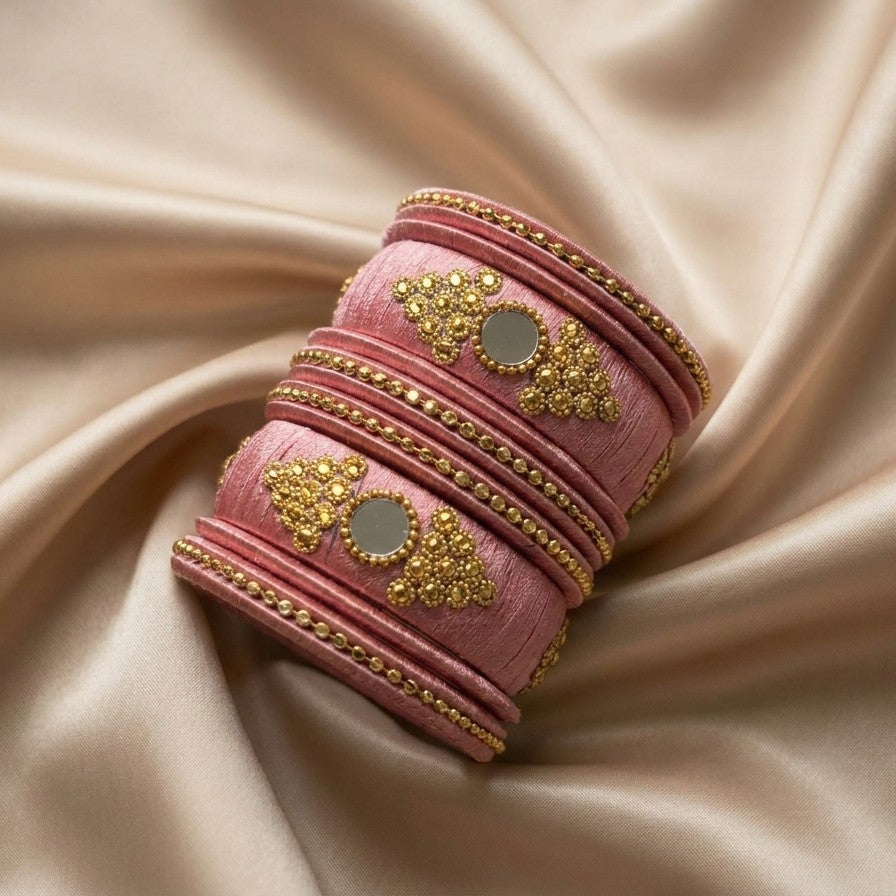 Crafted with rich silk thread and adorned with intricate golden embellishments, the Reshmi Bangles bring a bold festive charm to your look. Each stack carries a unique handcrafted touch — making every piece slightly different, yet equally stunning.