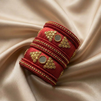 Crafted with rich silk thread and adorned with intricate golden embellishments, the Reshmi Bangles bring a bold festive charm to your look. Each stack carries a unique handcrafted touch — making every piece slightly different, yet equally stunning.