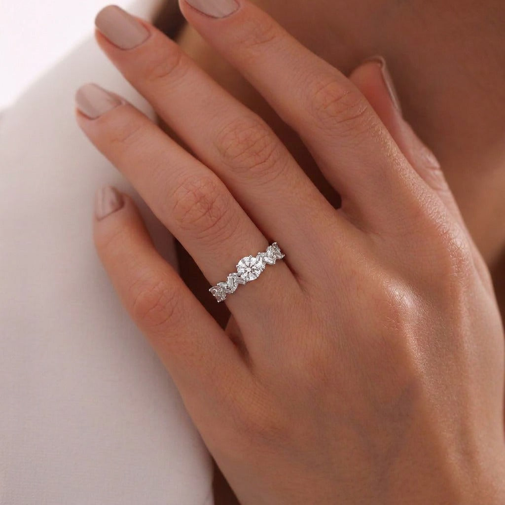 A graceful shimmer wrapped in timeless elegance, this ring blends delicate sparkle with a softly sculpted silhouette that feels effortlessly refined. The intertwined crystal design catches light beautifully, creating a subtle statement perfect for both everyday styling and special moments.
