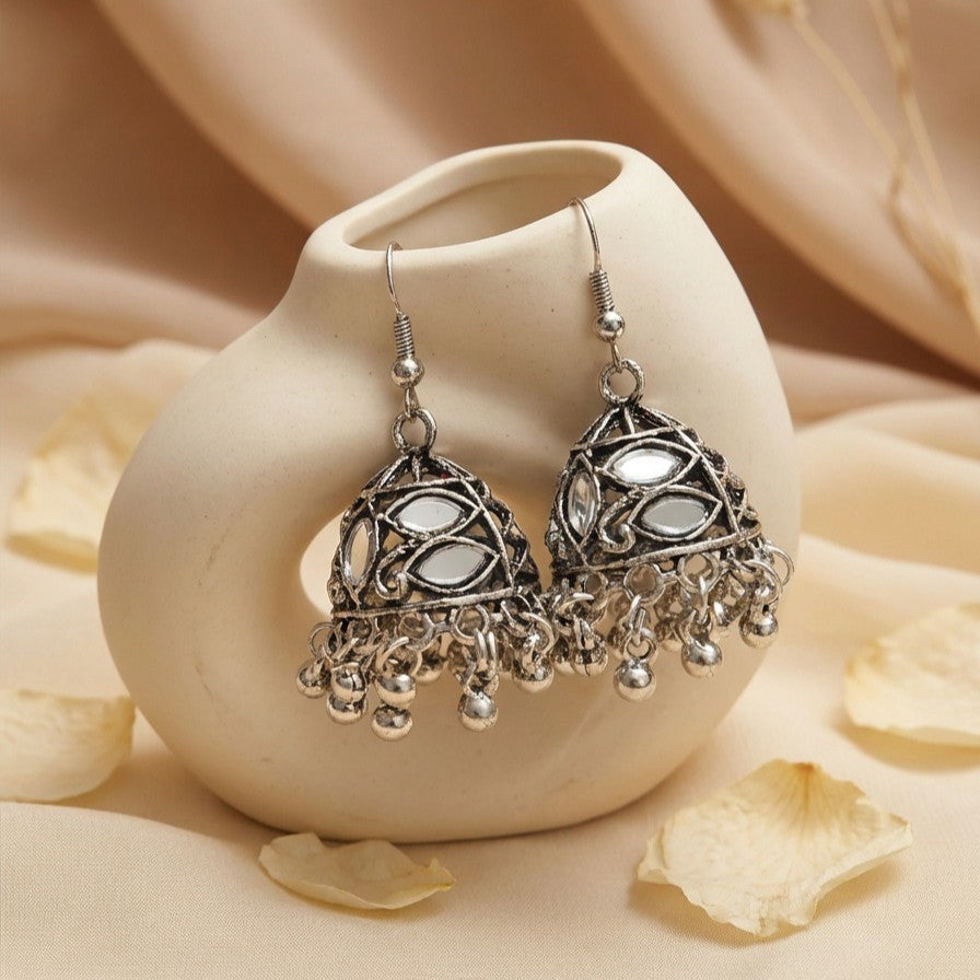 A subtle play of light and reflection, this piece captures the charm of traditional mirror work with a modern, elegant touch, The intricate dome design paired with delicate ghungroo drops creates a graceful movement that feels both festive and timeless