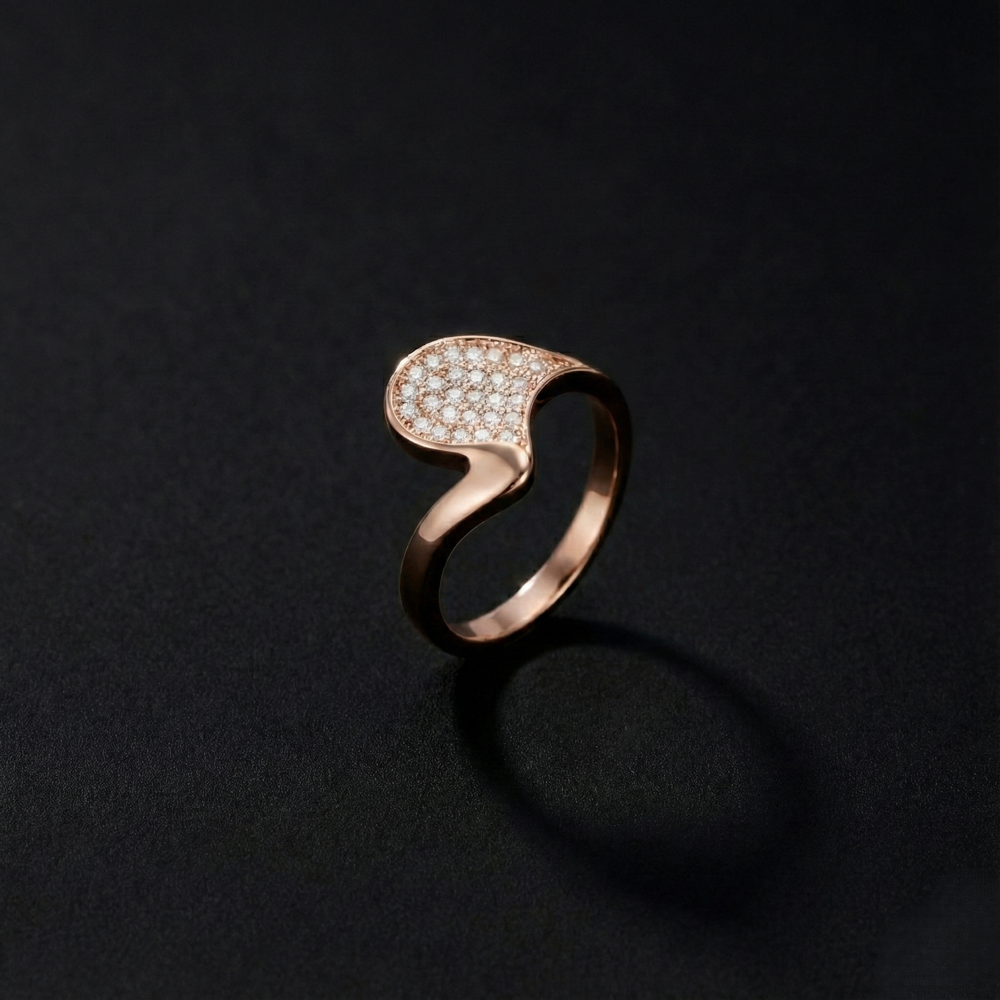 A refined statement ring shaped by gentle curves and subtle brilliance. The Zerelle Curve Ring features a fluid asymmetrical silhouette, accented with delicately set zircon stones that shimmer softly within its sculpted frame. Minimal yet expressive, it’s designed for those who love elegance that feels effortless, modern, and wearable every day.